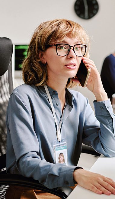 a young woman talking on the phone